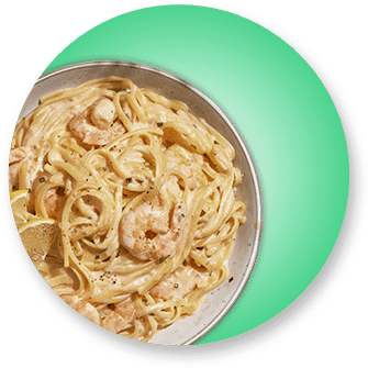 A bowl of pasta with shrimp and sauce.