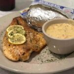 blackened redfish with a side of crawfish sauce